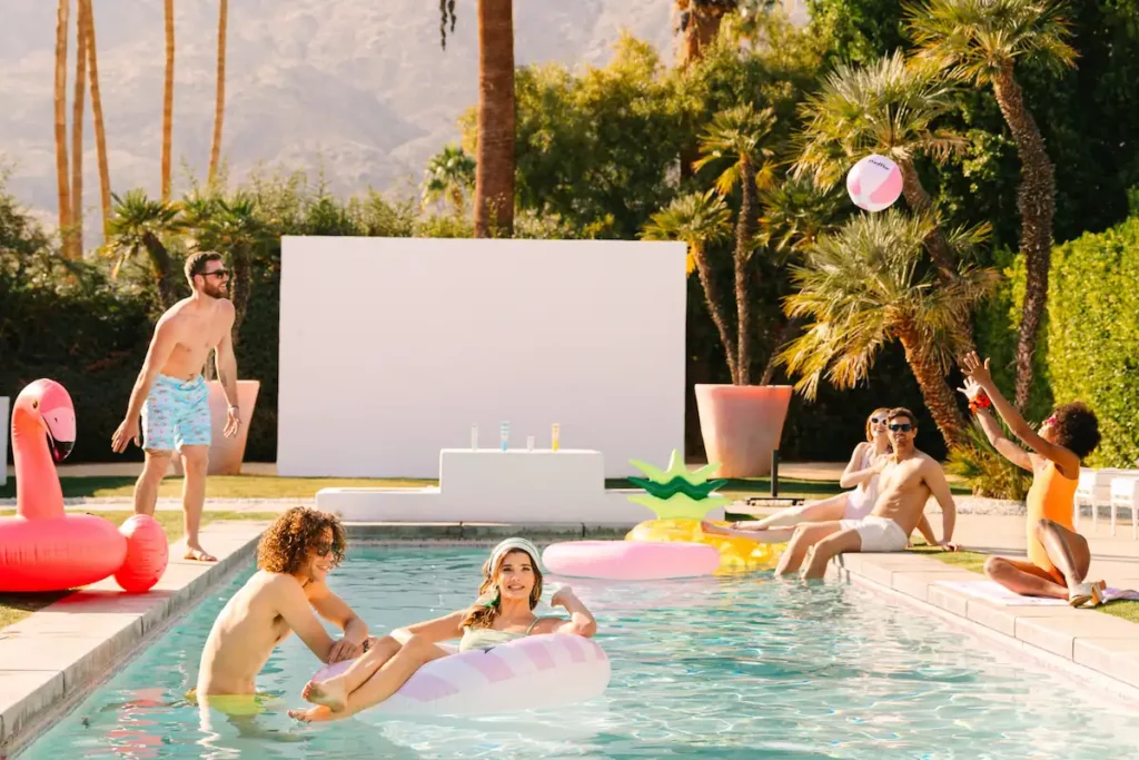 group of friends hanging out at the pool