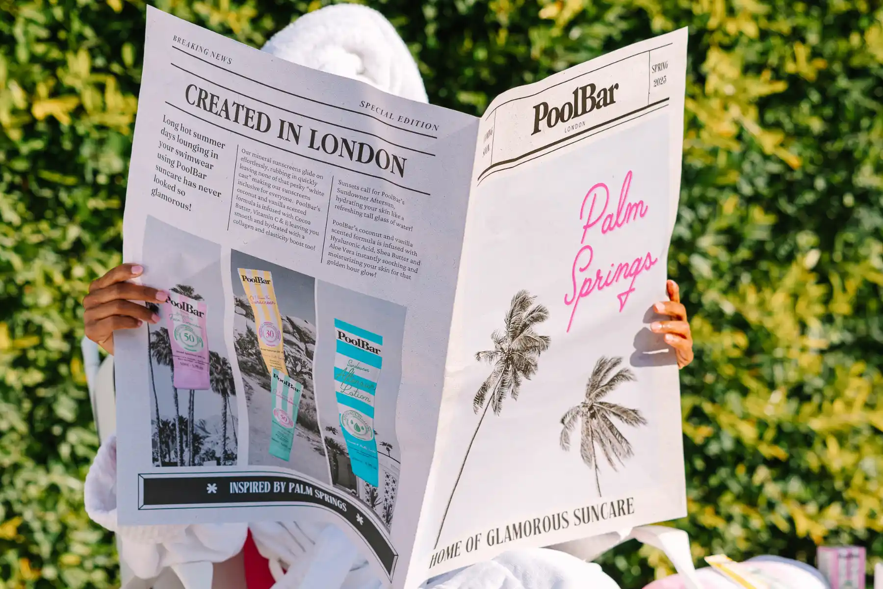 Woman reading PoolBar Newspaper