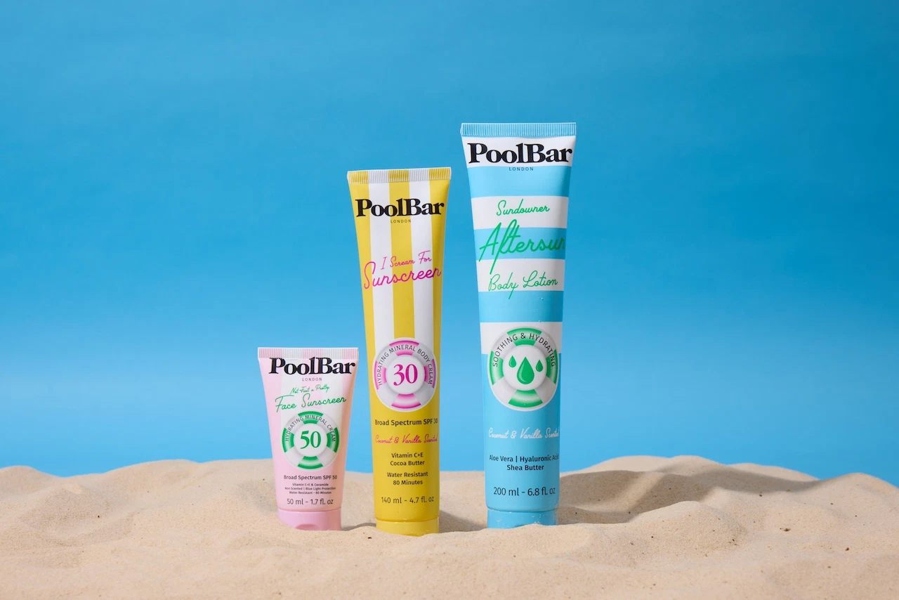 3 Sunscreen bottles in the sand