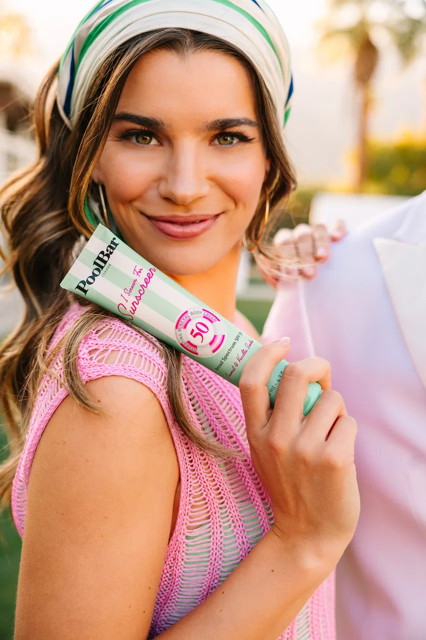 model holding with spf 50 body sunscreen